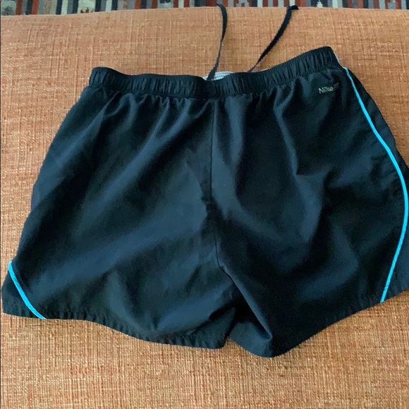 Black women’s Nike shorts with blue stripe - Picture 4 of 5